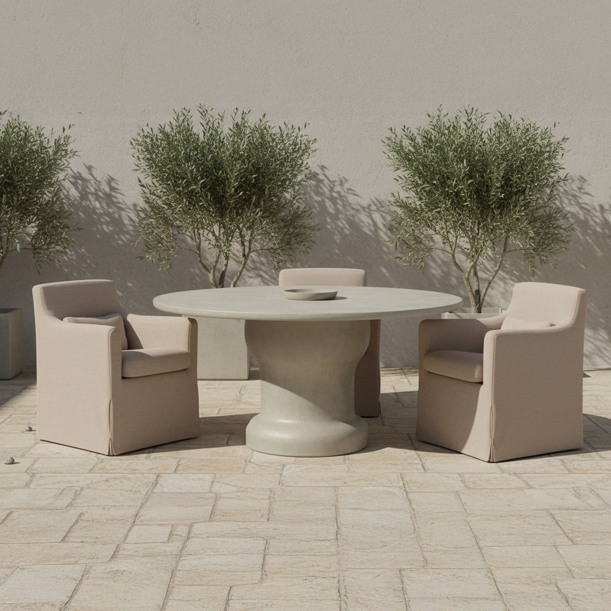 Light brown outdoor slipcover dining chair with padded seat and armrests