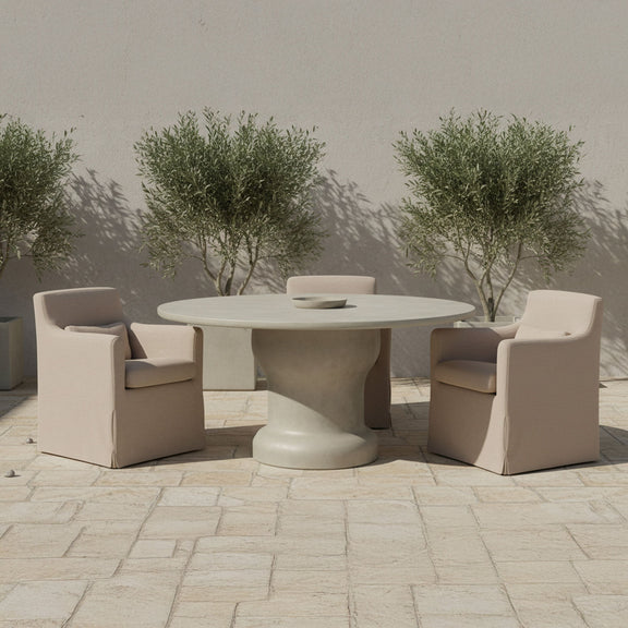 Light brown outdoor slipcover dining chair with padded seat and armrests