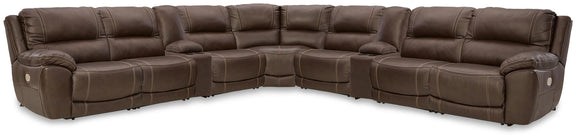 Dark brown power reclining sectional sofa with curved corner chaise and reclining seats