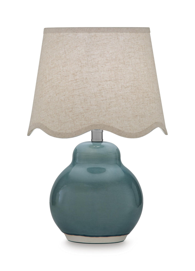 Blue ceramic table lamp with textured beige fabric shade