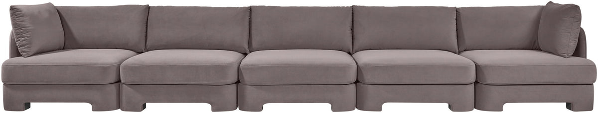Gray velvet upholstered sectional sofa with five-seat modular layout