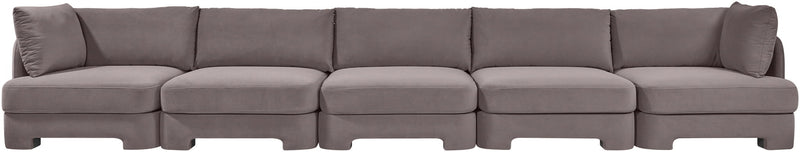 Gray velvet upholstered sectional sofa with five-seat modular layout