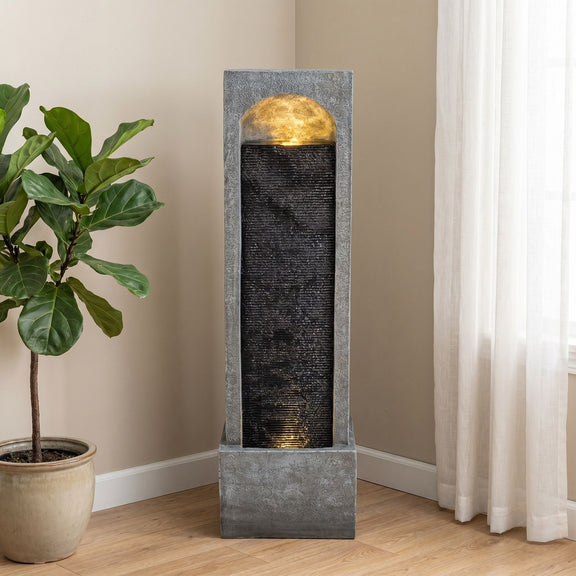 Tall floor fountain with a gray frame, black cascading panel, and gold-toned top