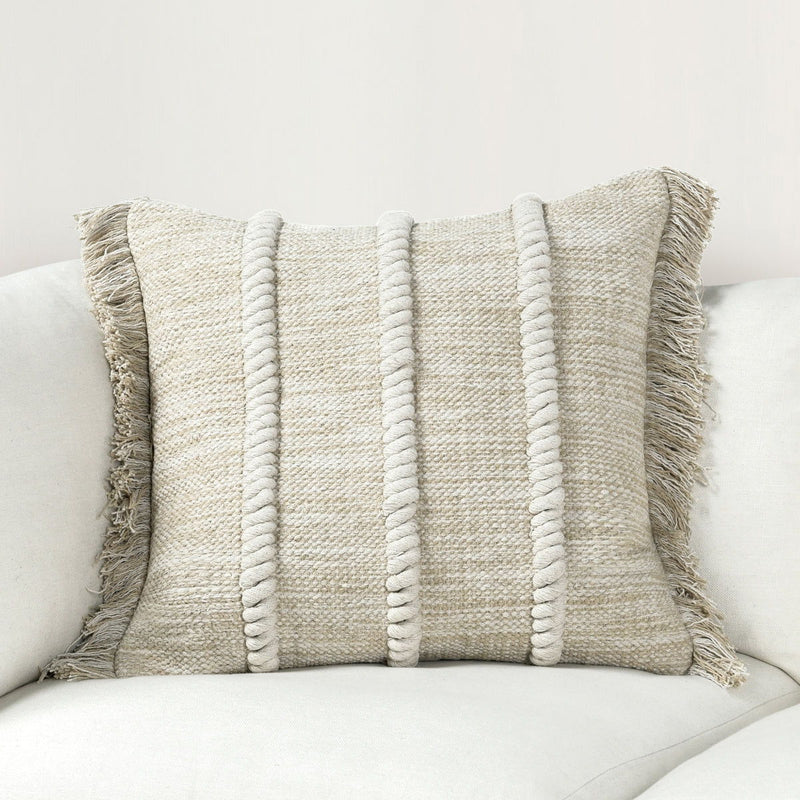 Natural fabric lumbar pillow with vertical stripe texture and fringe trim