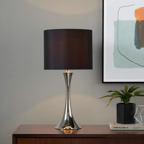 Modern table lamp with black fabric shade and chrome pedestal base