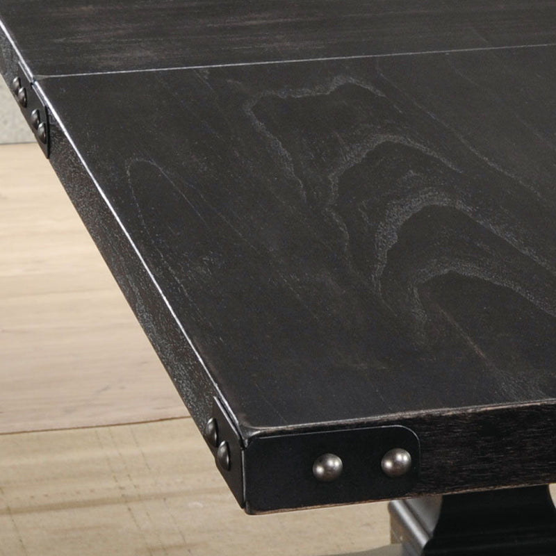 Black dining table edge with metal corner brackets and two round rivets