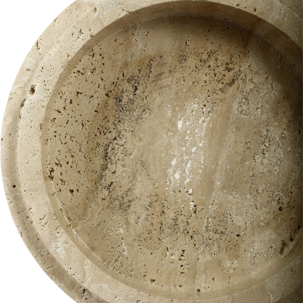 Close-up interior of light travertine bowl with smooth basin and speckling