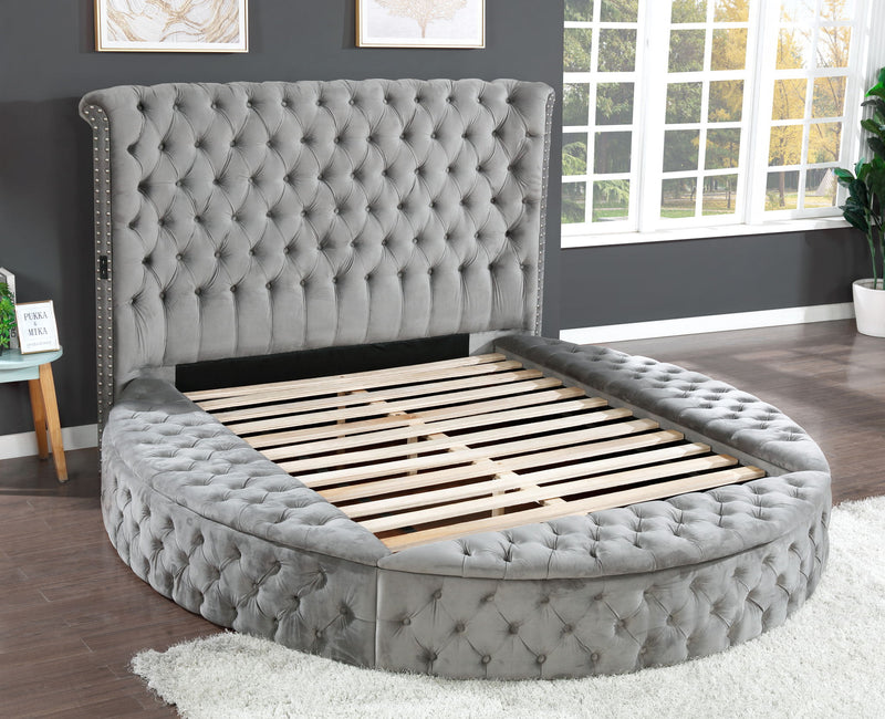 Gray round king bed with tufted headboard and slatted mattress support