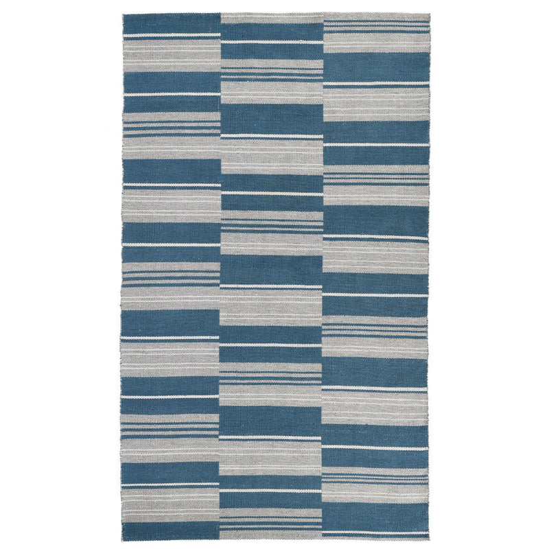 Indoor/outdoor striped patchwork rug with blue, gray, and light gray block pattern