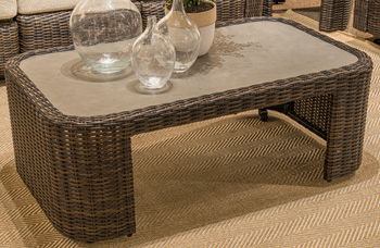 Mission Beach rectangular coffee table in dark brown woven wicker with a light inset top.