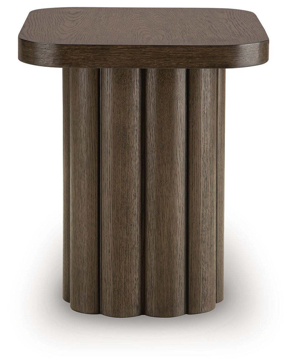 Dark brown rectangular table with smooth top and vertical fluted wood base