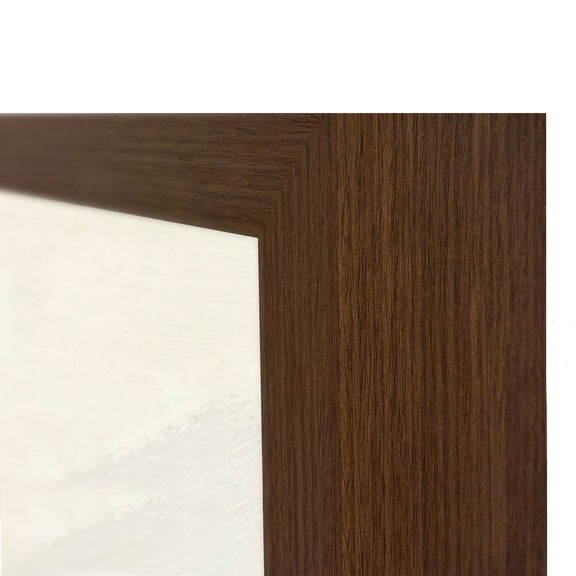 Dark brown wooden frame corner with visible wood grain beside white canvas.