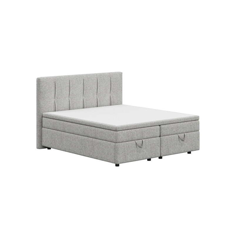 Light gray upholstered platform bed with tufted headboard and built-in storage drawers