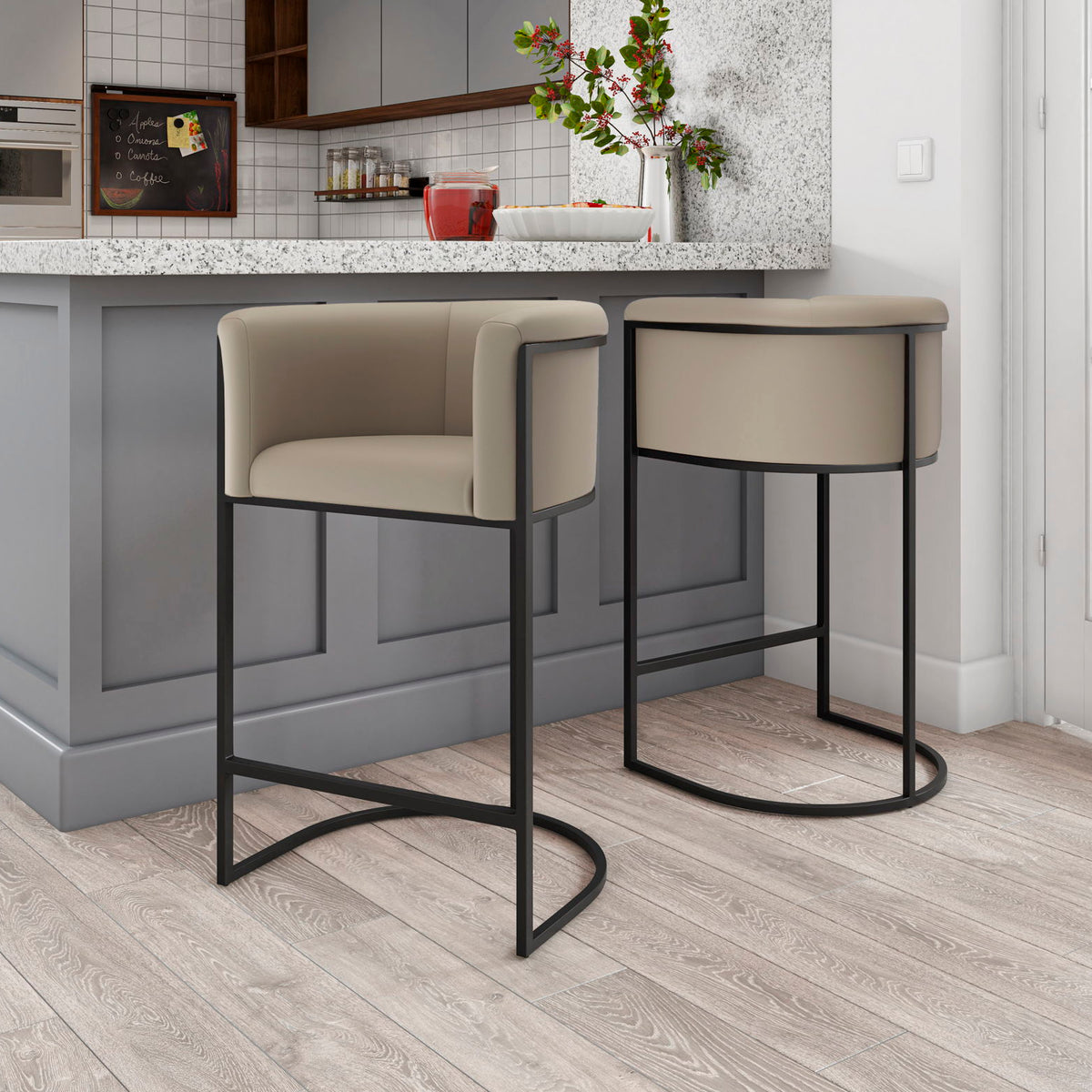 Set of two light beige upholstered counter stools with black metal bases