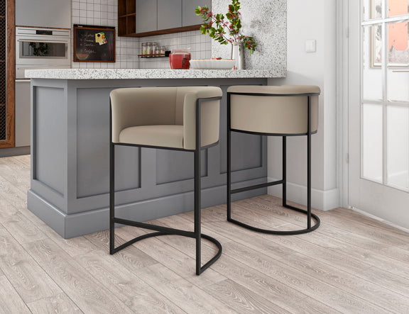 Set of two light beige upholstered counter stools with black metal bases