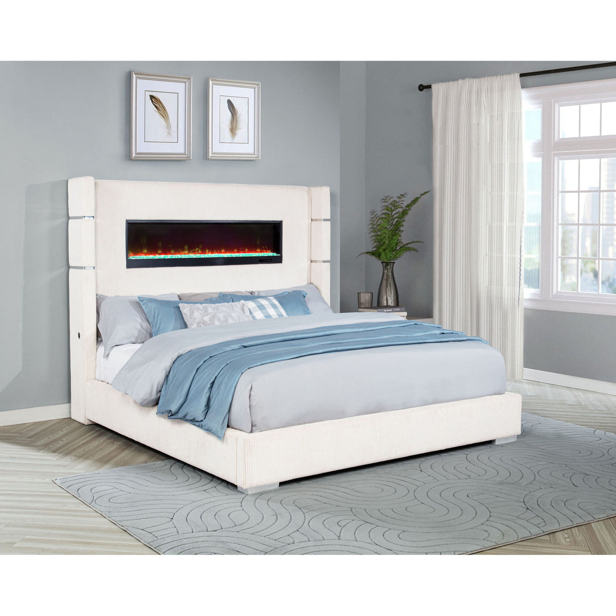 Upholstered platform bed with light-blue bedding and built-in flame visualizer screen