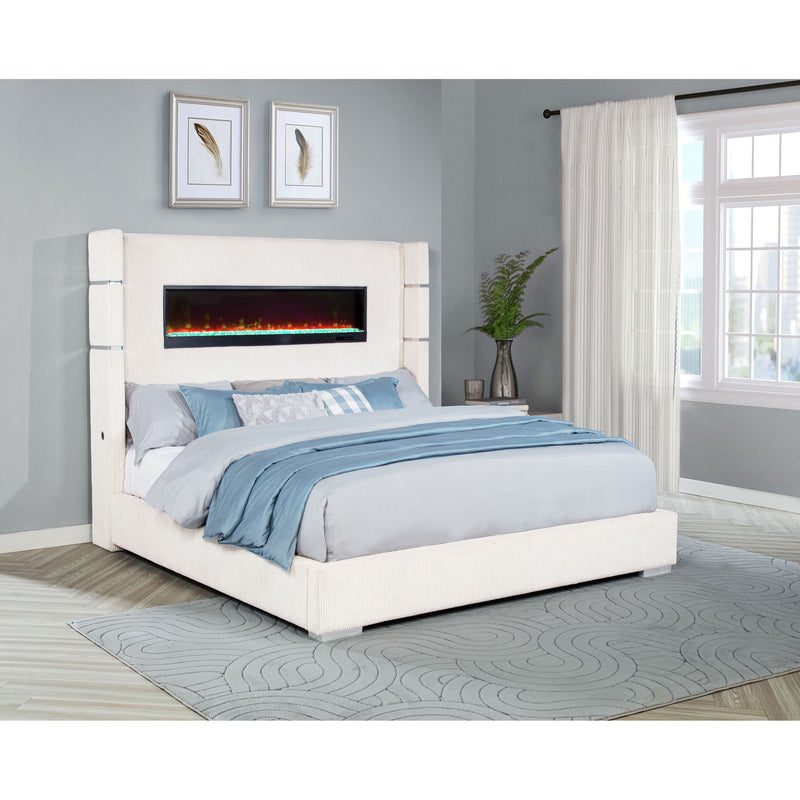 Upholstered platform bed with light-blue bedding and built-in flame visualizer screen