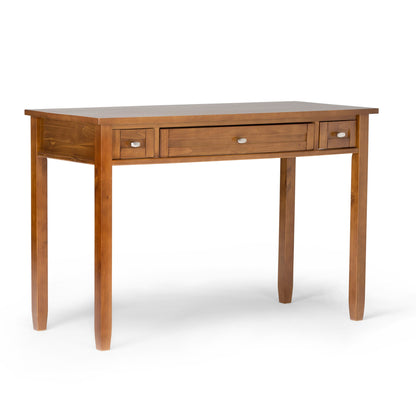 Light brown shaker-style desk with 3 drawers and side shelf, tapered legs