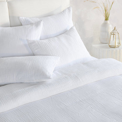 White textured duvet and pillows with crinkled woven fabric