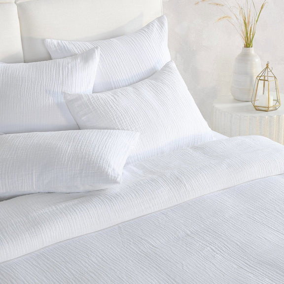 White textured duvet and pillows with crinkled woven fabric