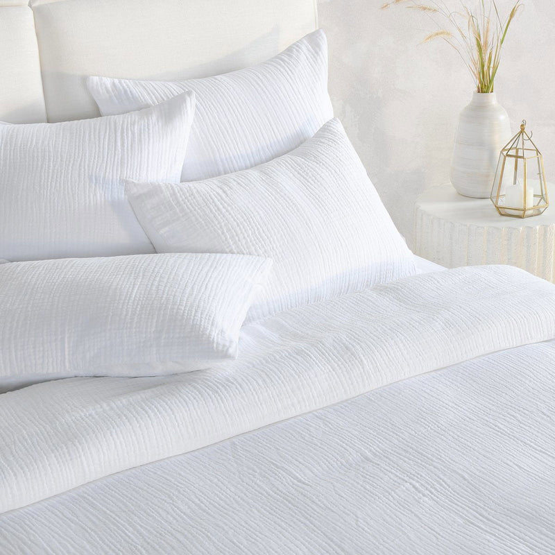 White textured duvet and pillows with crinkled woven fabric