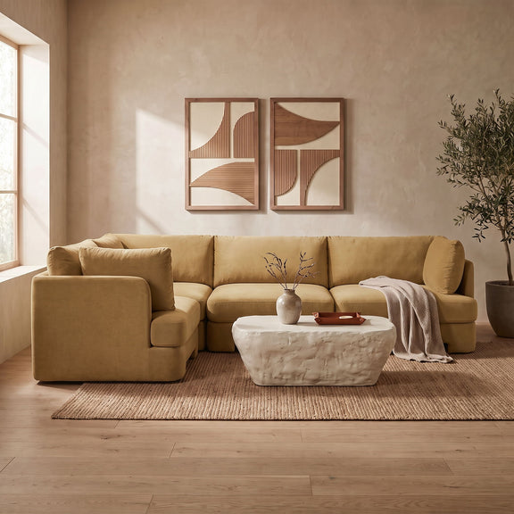 Beige velvet performance fabric sectional with chaise-style corner and tufted back cushions