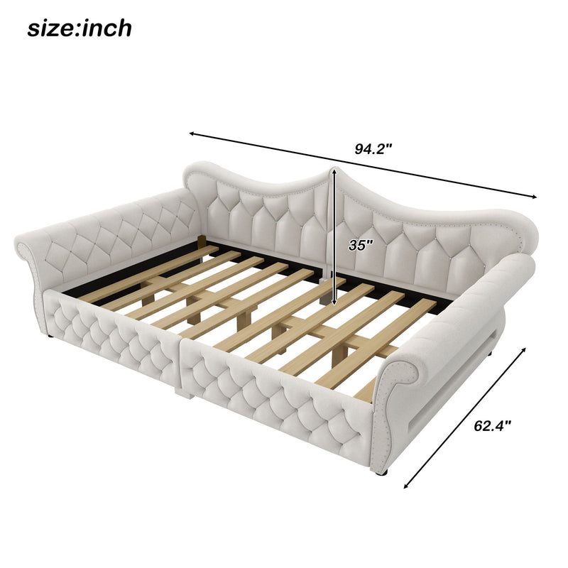Tufted upholstered daybed with curved arms and light fabric, slatted base