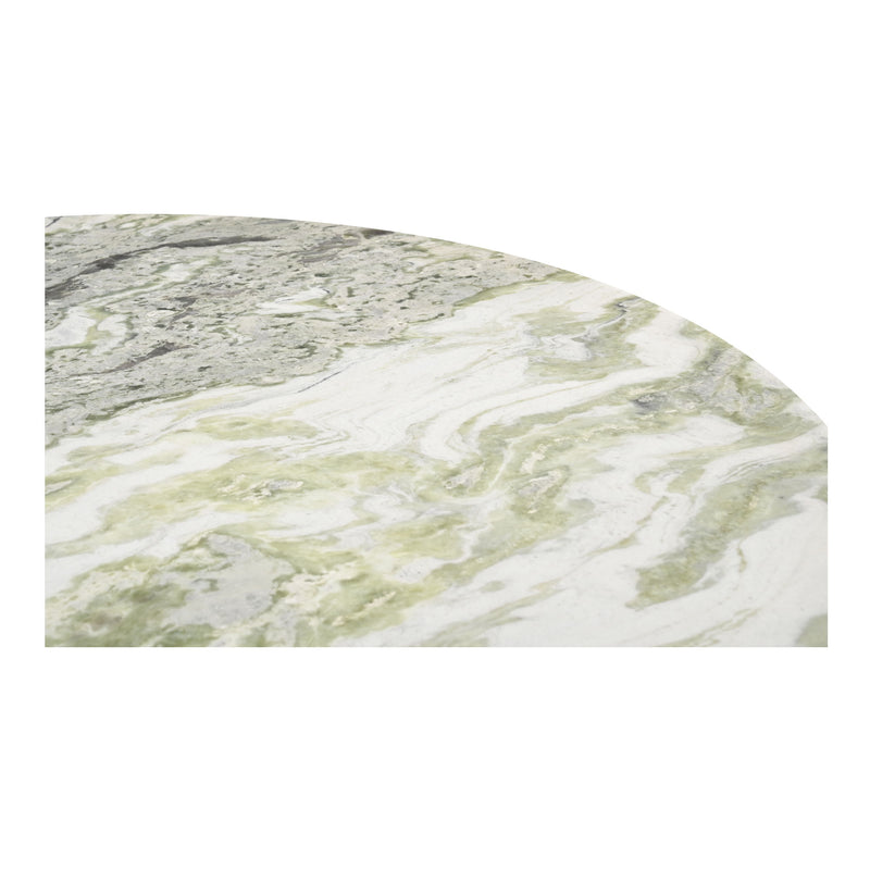 Close-up of the dining table's pale green and gray veined stone surface.