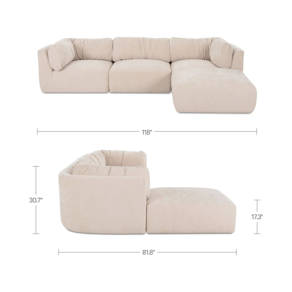 Oatmeal modular sectional sofa with rounded back cushions and chaise ottoman