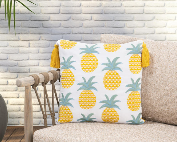 Pineapple print throw pillow with yellow fruit, teal leaves, and mustard tassel trim