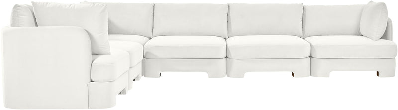 White velvet corner sectional sofa with low back cushions and deep seat sections