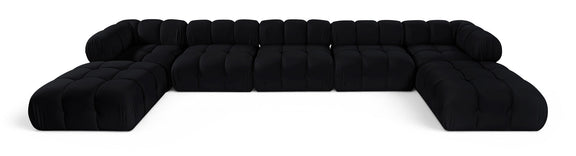 Black modular sectional sofa with tufted cushions and rounded armrests, curved layout