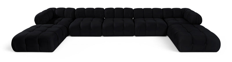 Black modular sectional sofa with tufted cushions and rounded armrests, curved layout