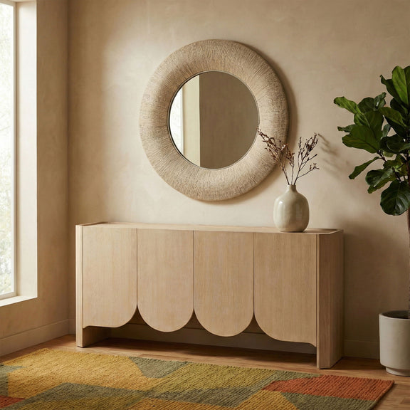 Round jute rope framed mirror on wall, light brown textured rope border, full oval view