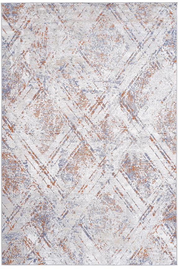 Beige geometric area rug with distressed abstract shapes and diagonal line details.