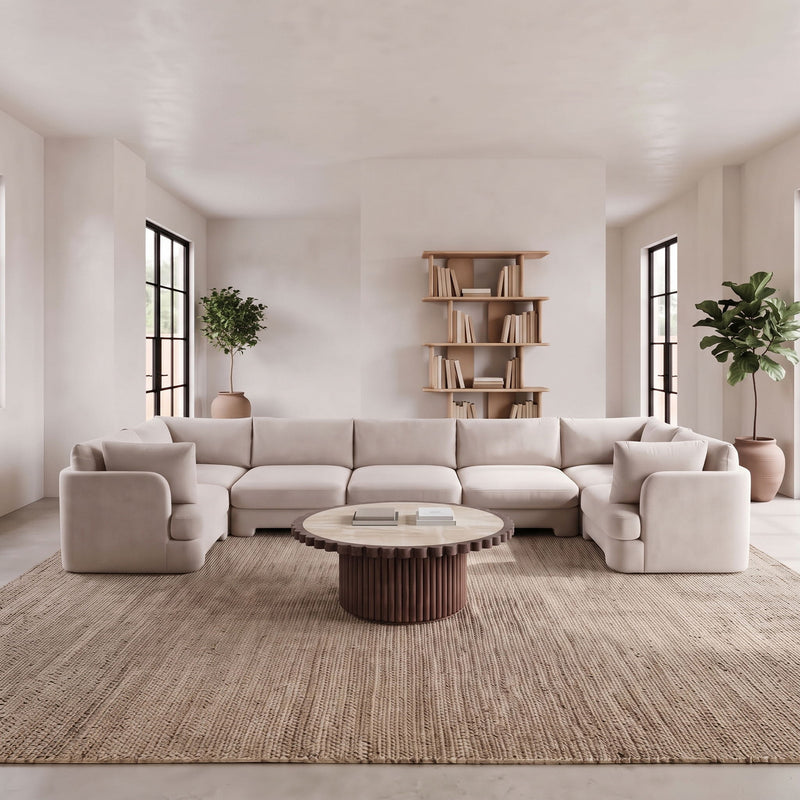 Light gray U-shaped sectional sofa with thick arms and deep seat cushions