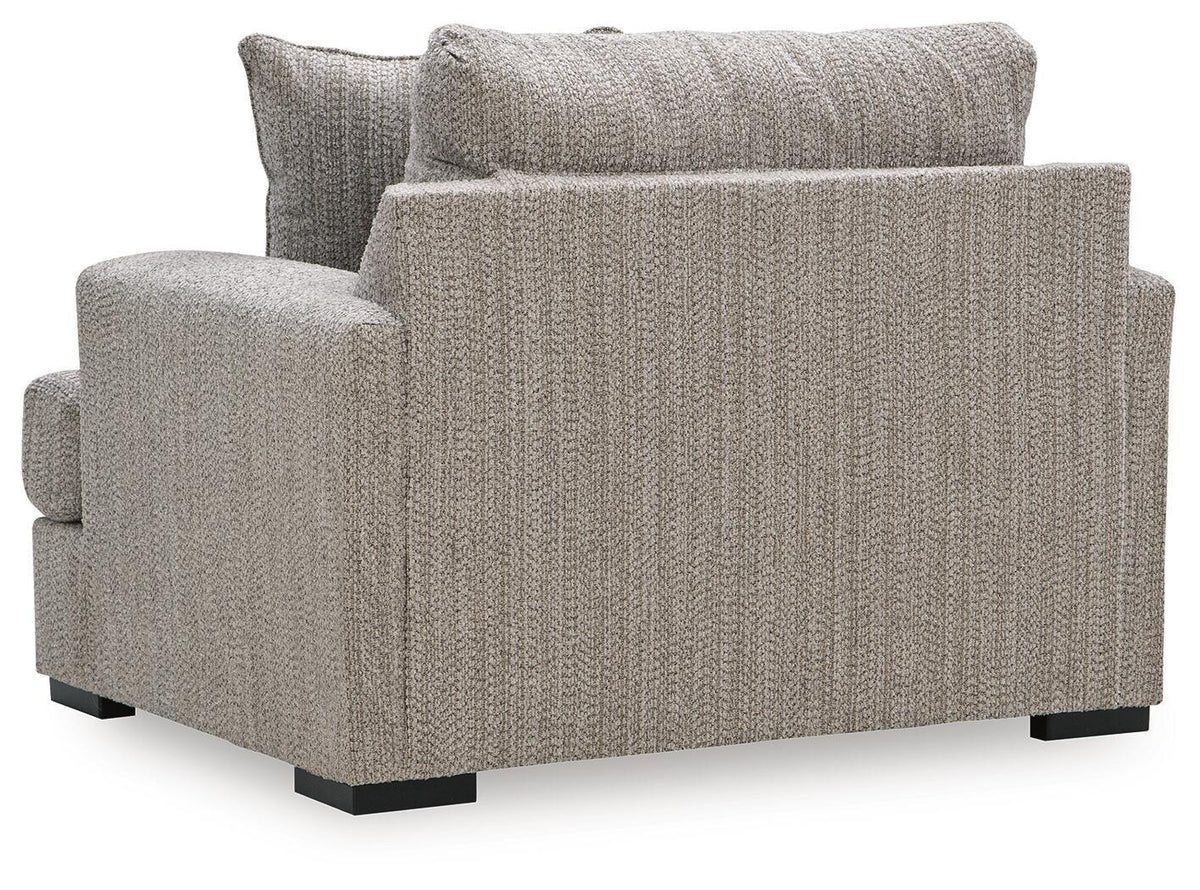 Gray chair and a half with textured fabric, rolled back, and black legs