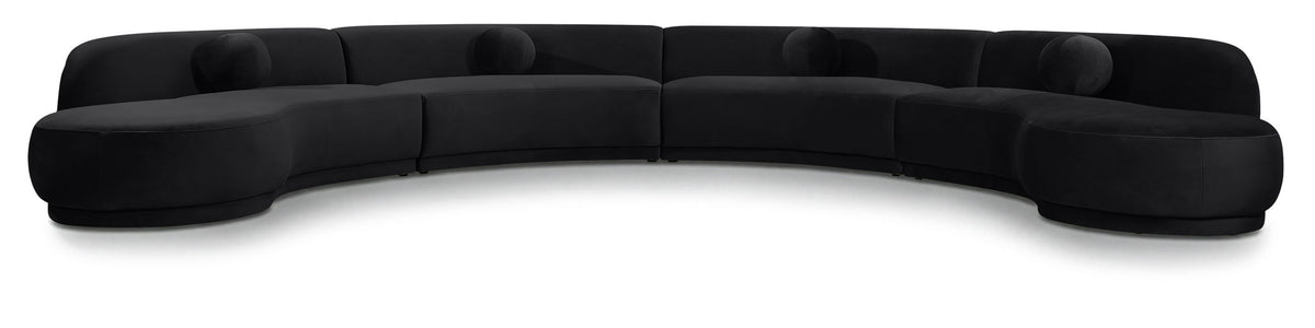 Black velvet sectional sofa with curved seat and padded arms
