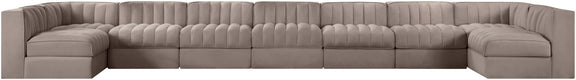 Beige armless velvet modular sectional with deep tufted back cushions and wide arms