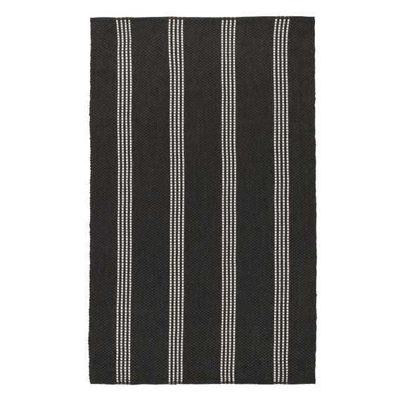 Charcoal area rug with multiple vertical ivory stripe lines and flat woven texture