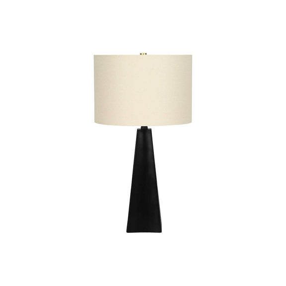 Black resin table lamp base with tapered sides and off-white fabric drum shade