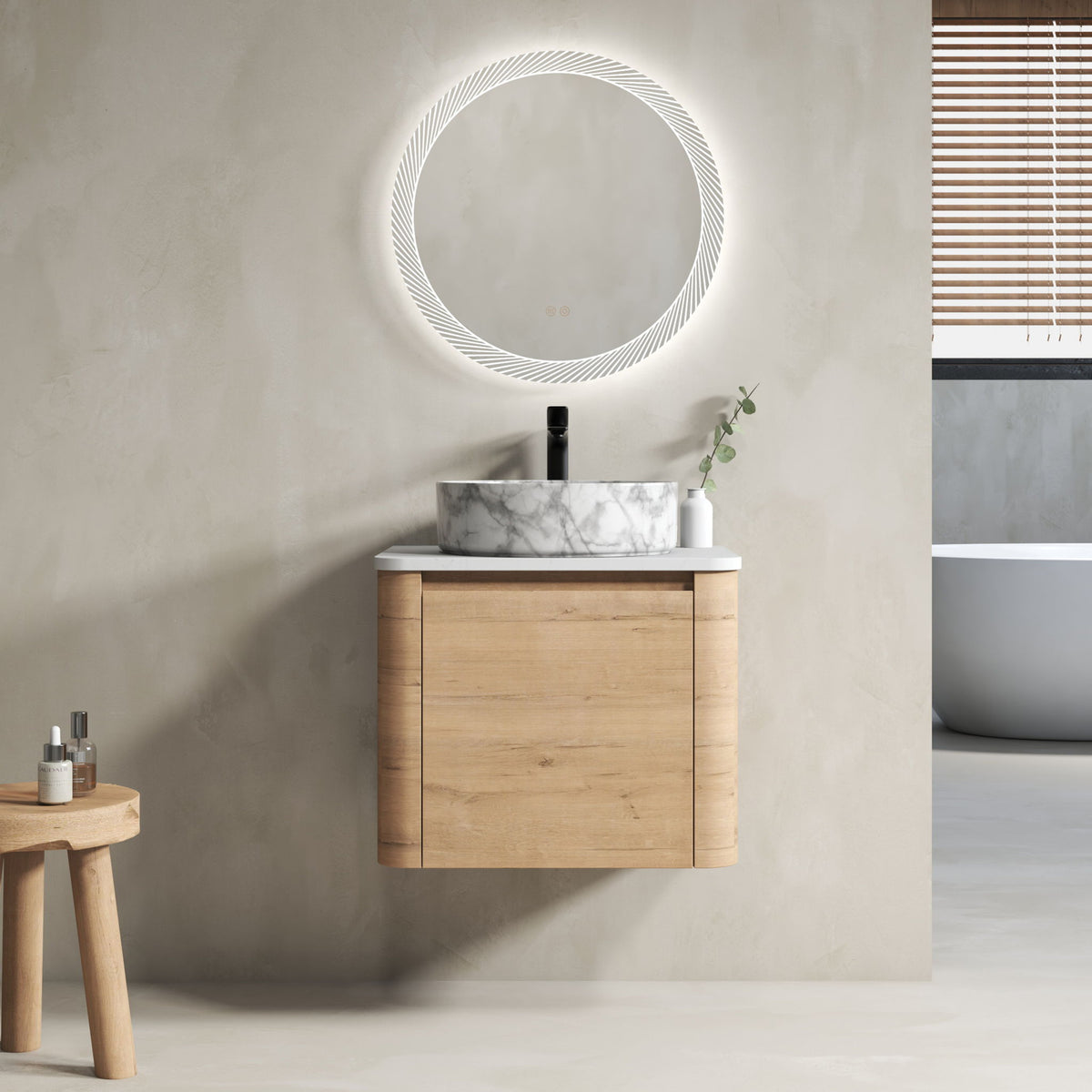 Wall-mounted bathroom vanity with white marble-look vessel sink, light wood cabinet, faucet