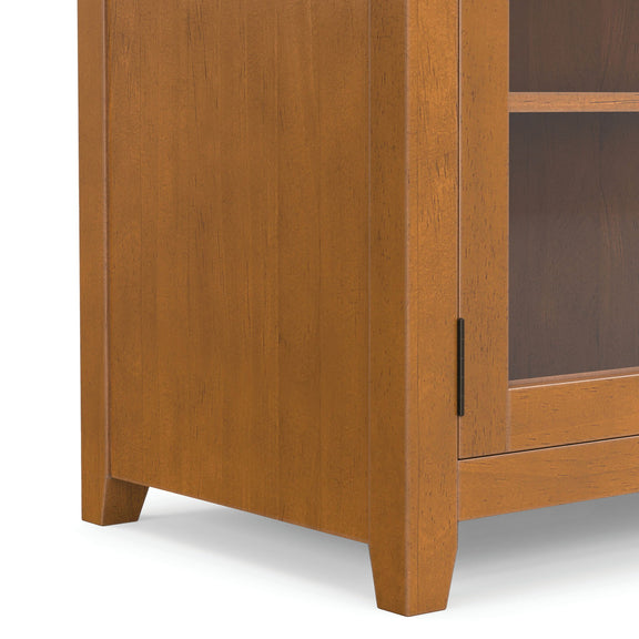 Light brown cabinet side panel with vertical grain and metal handle