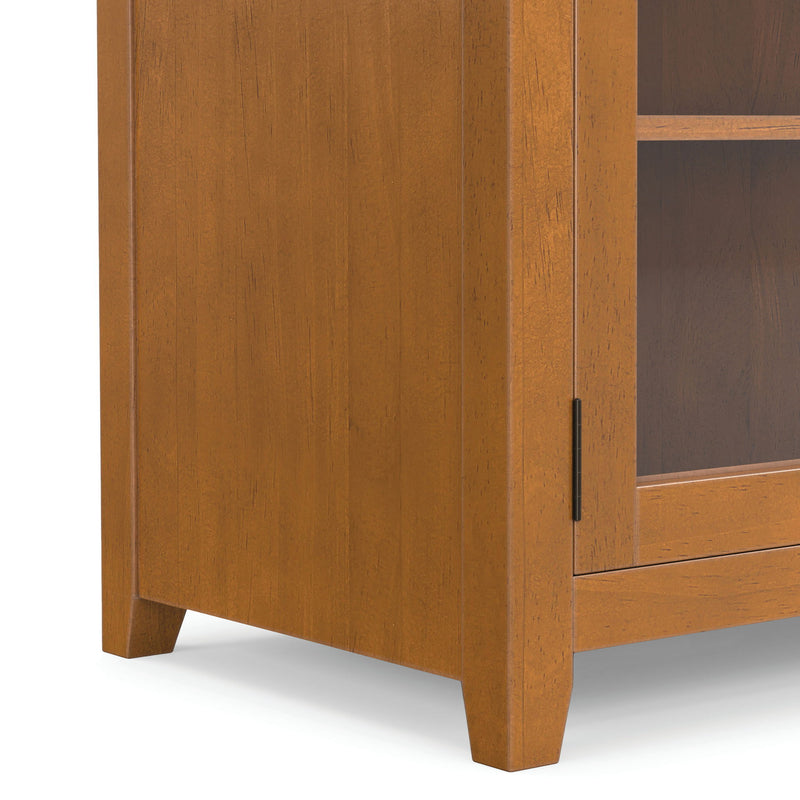 Light brown cabinet side panel with vertical grain and metal handle