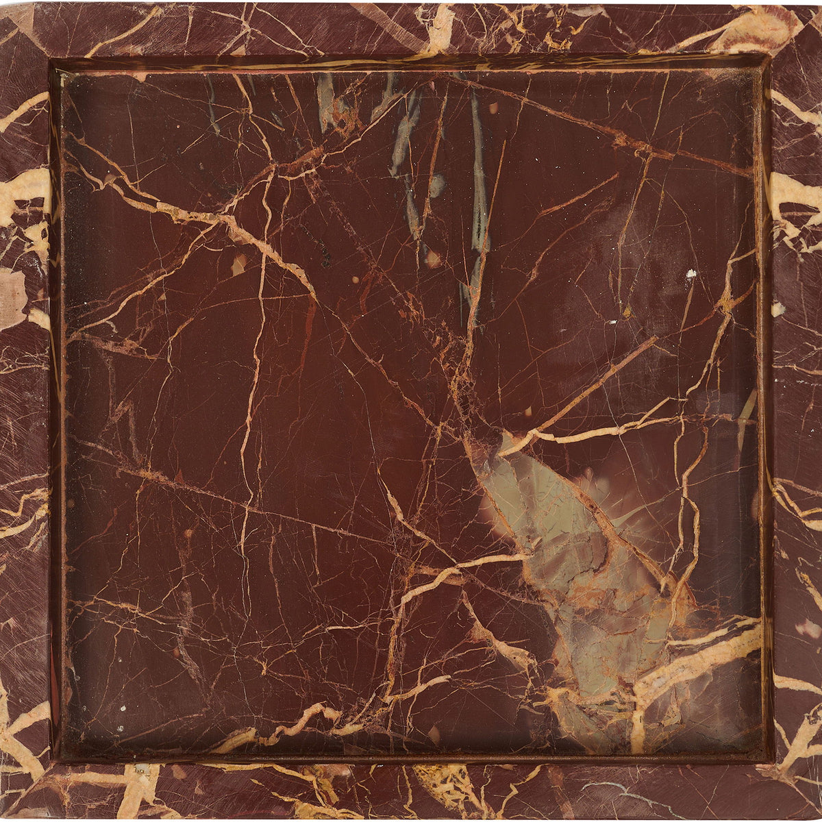 Dark red and gold marble tray with intricate vein pattern and polished finish.