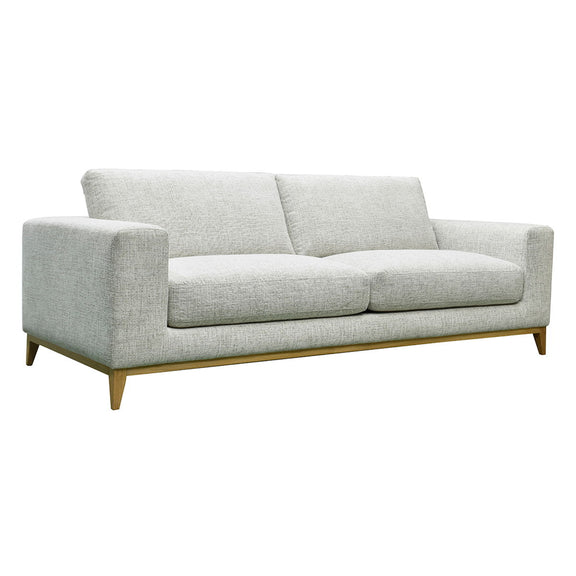 Donovan sofa in light gray fabric with two seat cushions and tapered wooden legs.