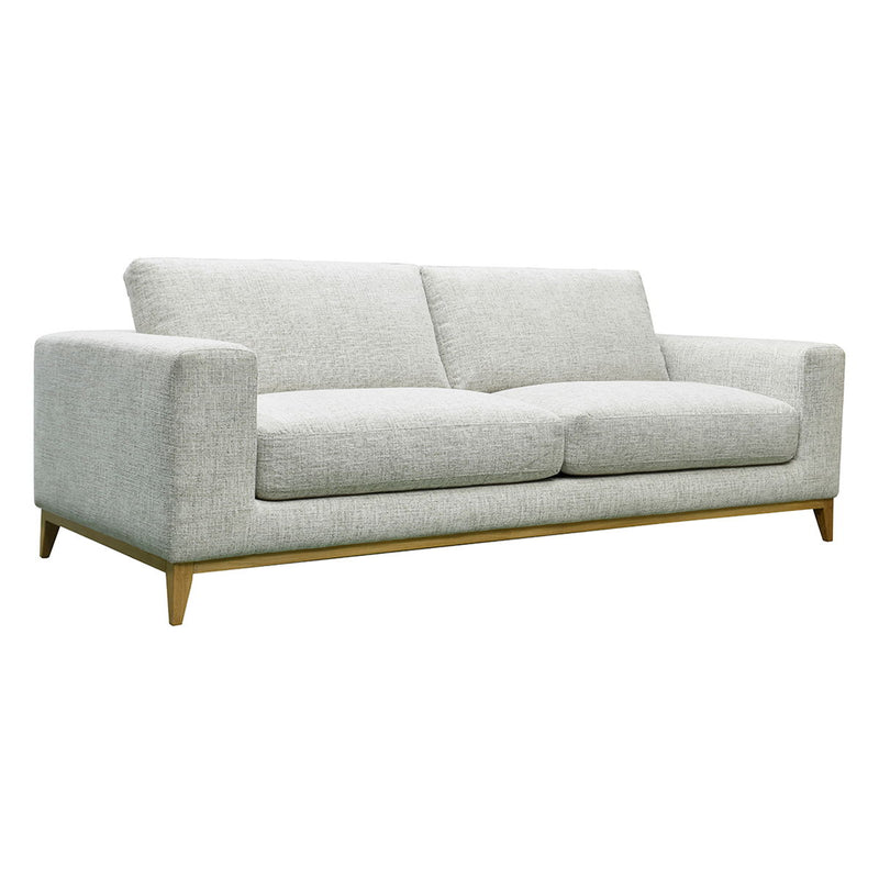 Donovan sofa in light gray fabric with two seat cushions and tapered wooden legs.