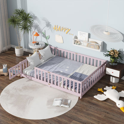 Pink full-size floor bed with safety guardrails