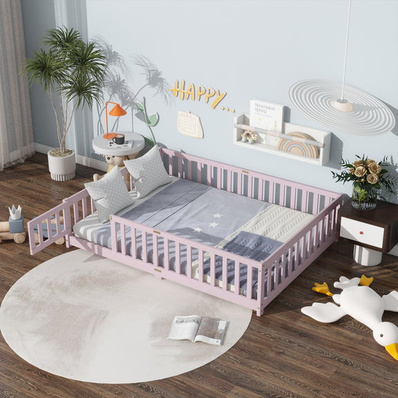 Pink full-size floor bed with safety guardrails