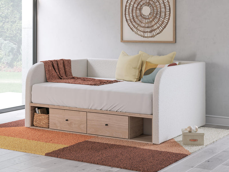 Beige upholstered day bed with two under-bed drawers and seat cushion